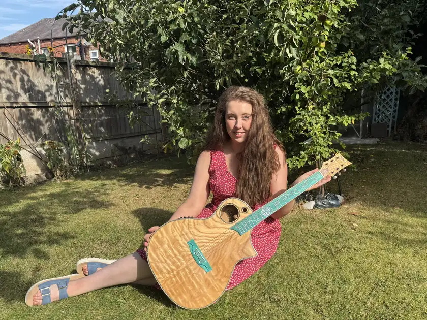 Winner photo for WEEK 29 Lindo Earth V2 Slim Body Electro Acoustic Guitar and Premium Hard Case