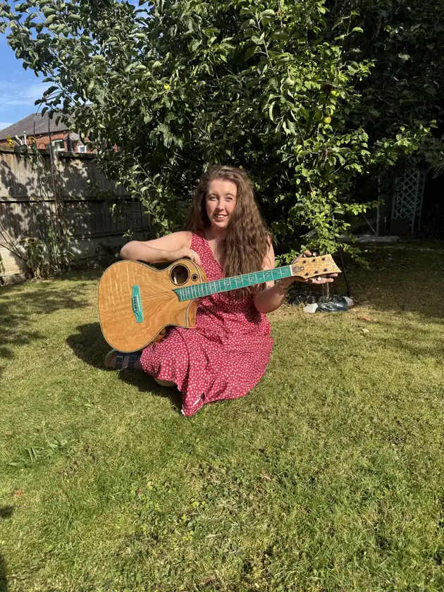 Winner photo for WEEK 29 Lindo Earth V2 Slim Body Electro Acoustic Guitar and Premium Hard Case